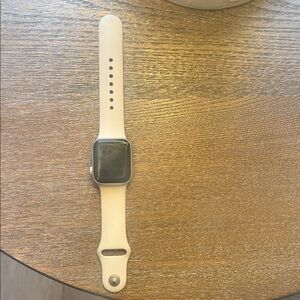 Apple Watch SE in Starlight, gently used. Free screen protectors and unused band